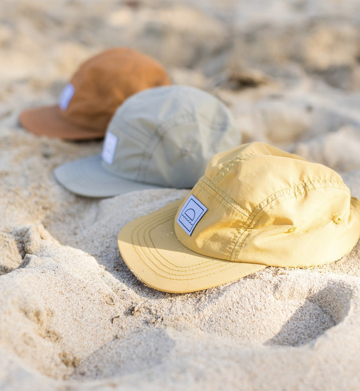 Hey August product flat lay, sunshine yellow cap